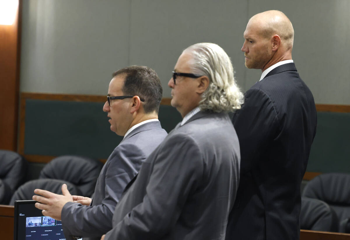 Attorney Richard Schonfeld, left, addresses the court as Daniel Rodimer, right, and attorney Da ...