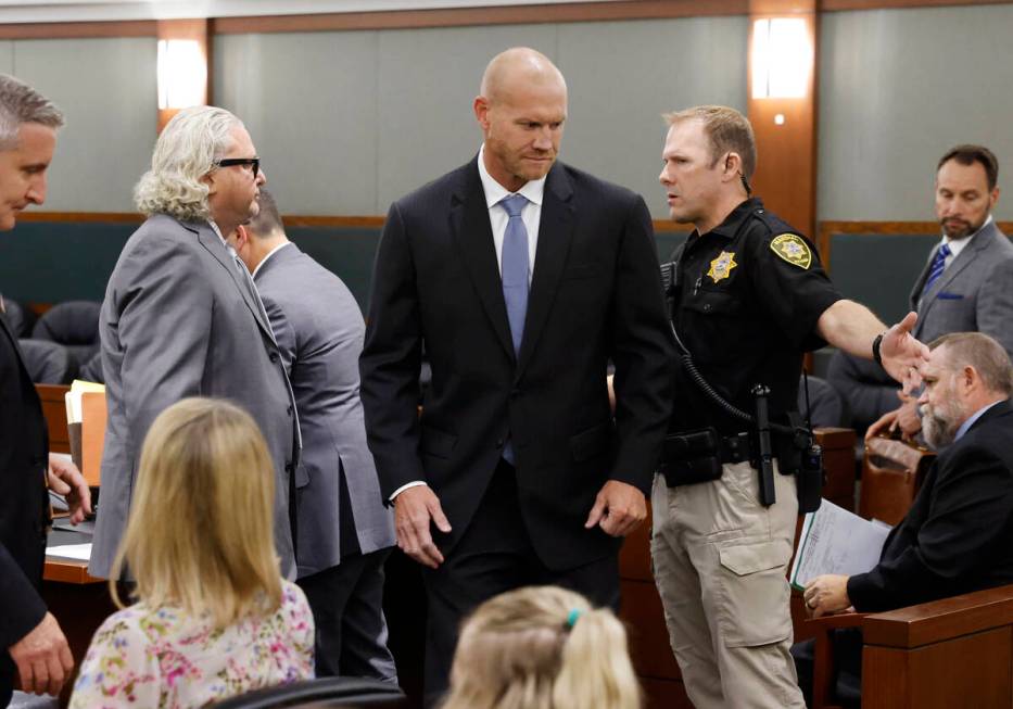 Daniel Rodimer, center, leaves a courtroom as his attorney David Chesnoff, left, looks on after ...