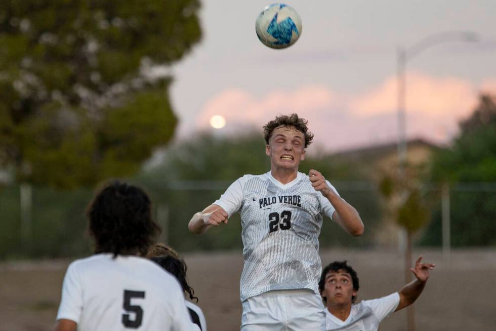 Palo Verde senior Benjamin Legrand (23) headbutts the ball during the high school soccer game a ...