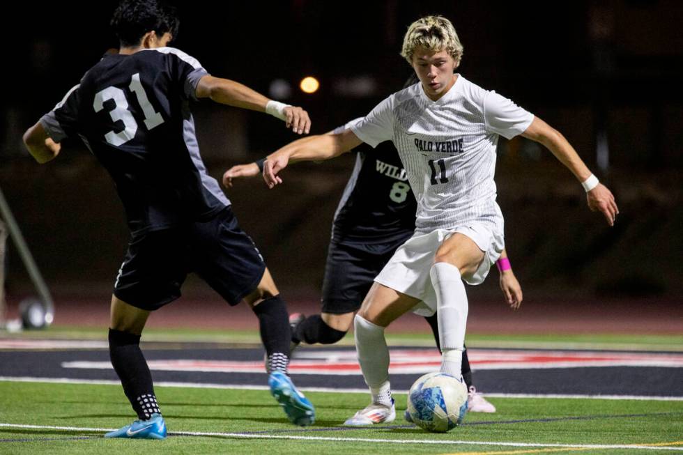 Palo Verde junior Noah Johnson (11) attempts to keep the ball during the high school soccer gam ...