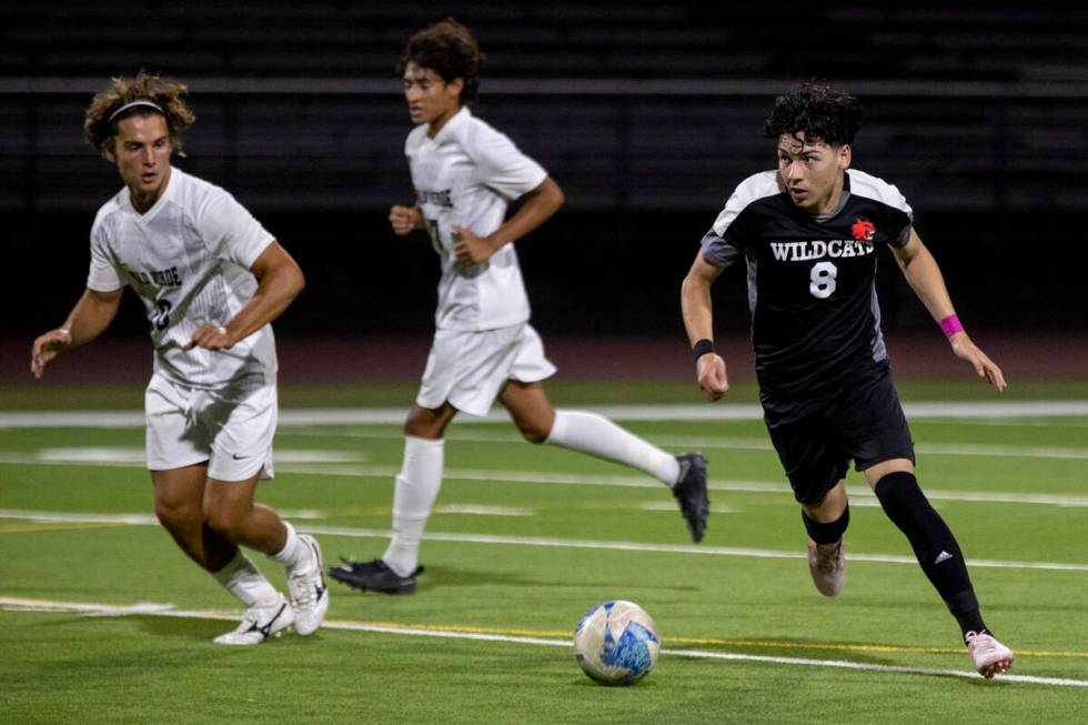 Las Vegas High senior Oscar Sandoval (8) competes during the high school soccer game against Pa ...