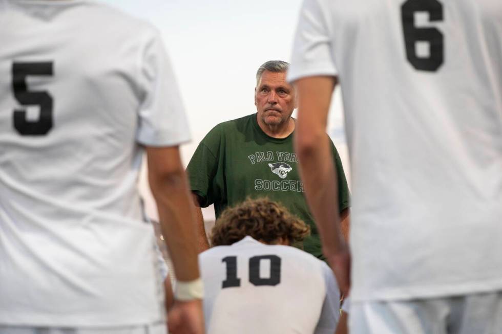 Palo Verde Head Coach Scott Hunt talks to the team at halftime during the high school soccer ga ...