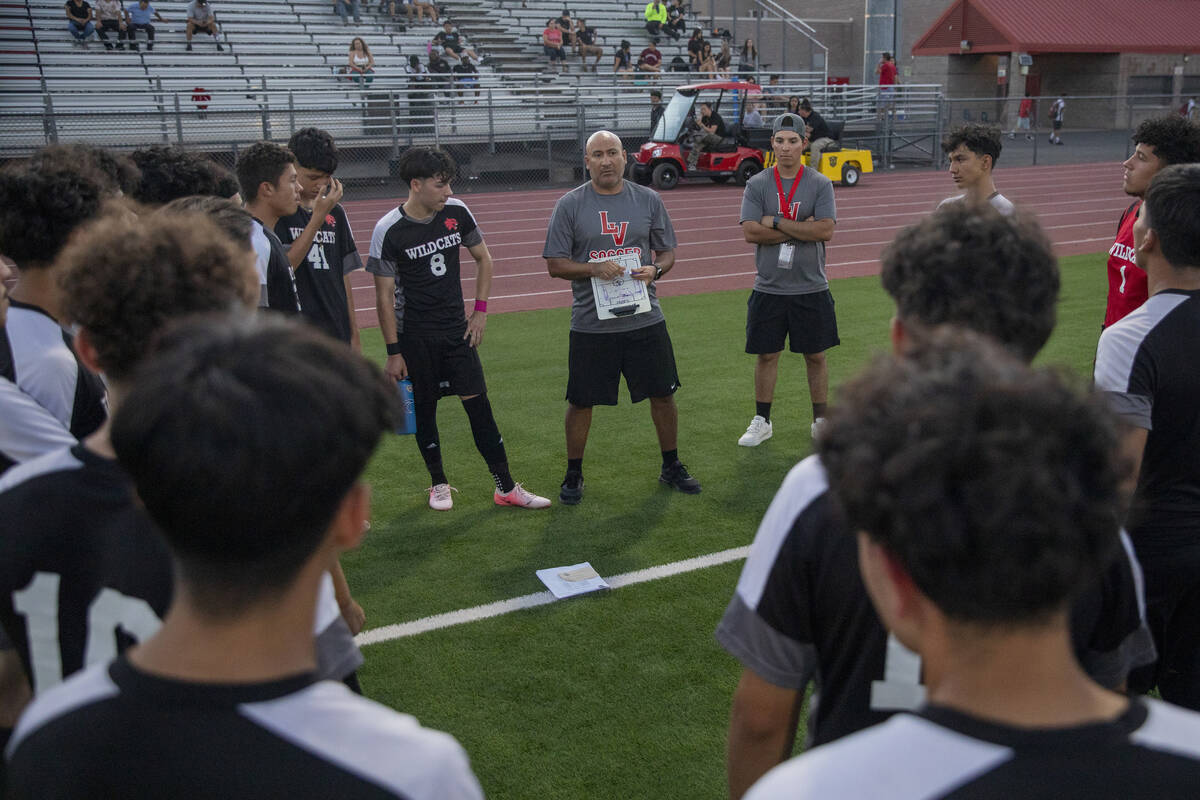 Las Vegas High Head Coach Alvaro Zetino talks to the team at halftime during the high school so ...