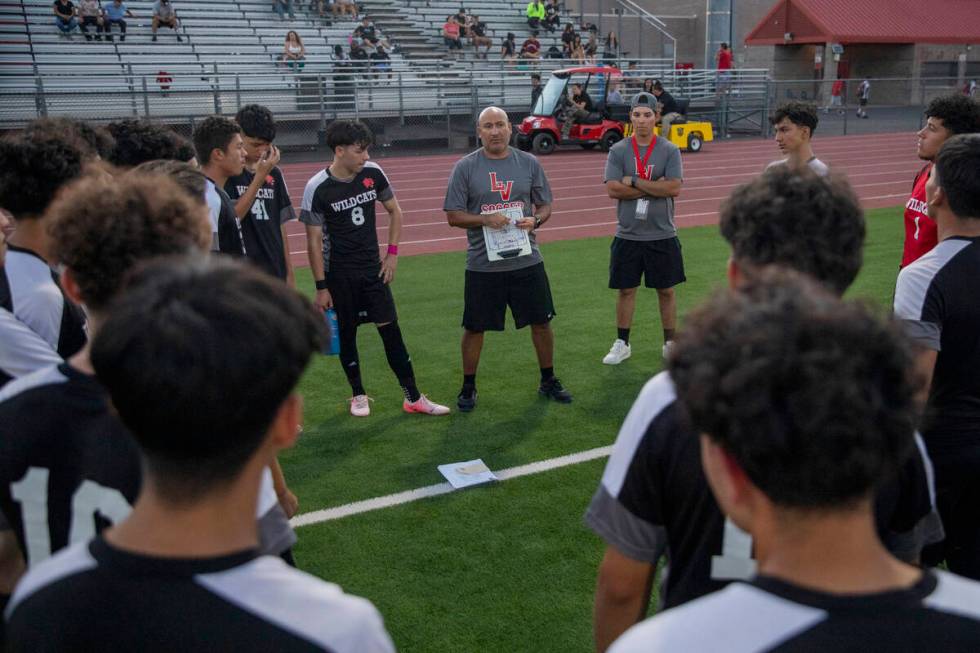 Las Vegas High Head Coach Alvaro Zetino talks to the team at halftime during the high school so ...