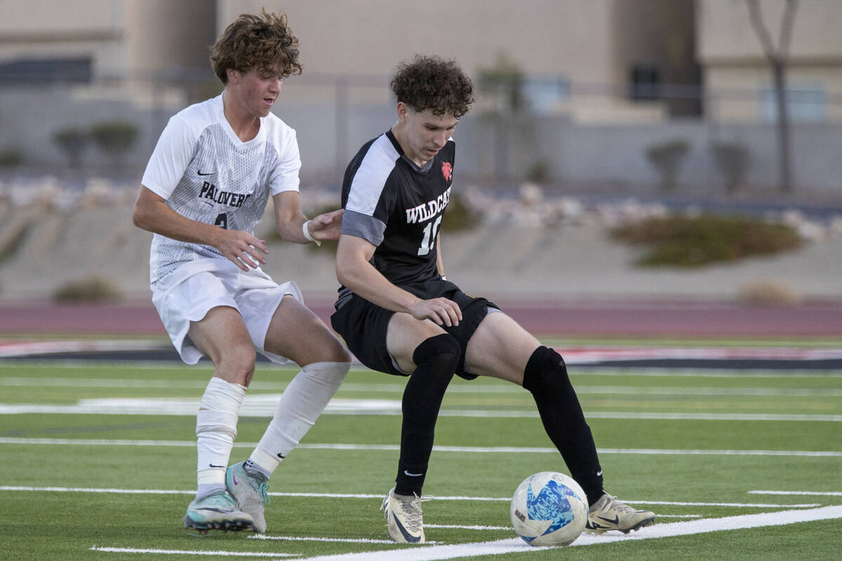 Las Vegas High senior Daniel Murillo (10) competes for the ball with Palo Verde senior Jaxon La ...