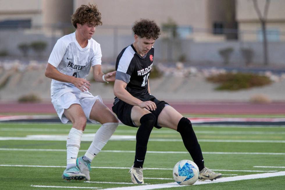 Las Vegas High senior Daniel Murillo (10) competes for the ball with Palo Verde senior Jaxon La ...