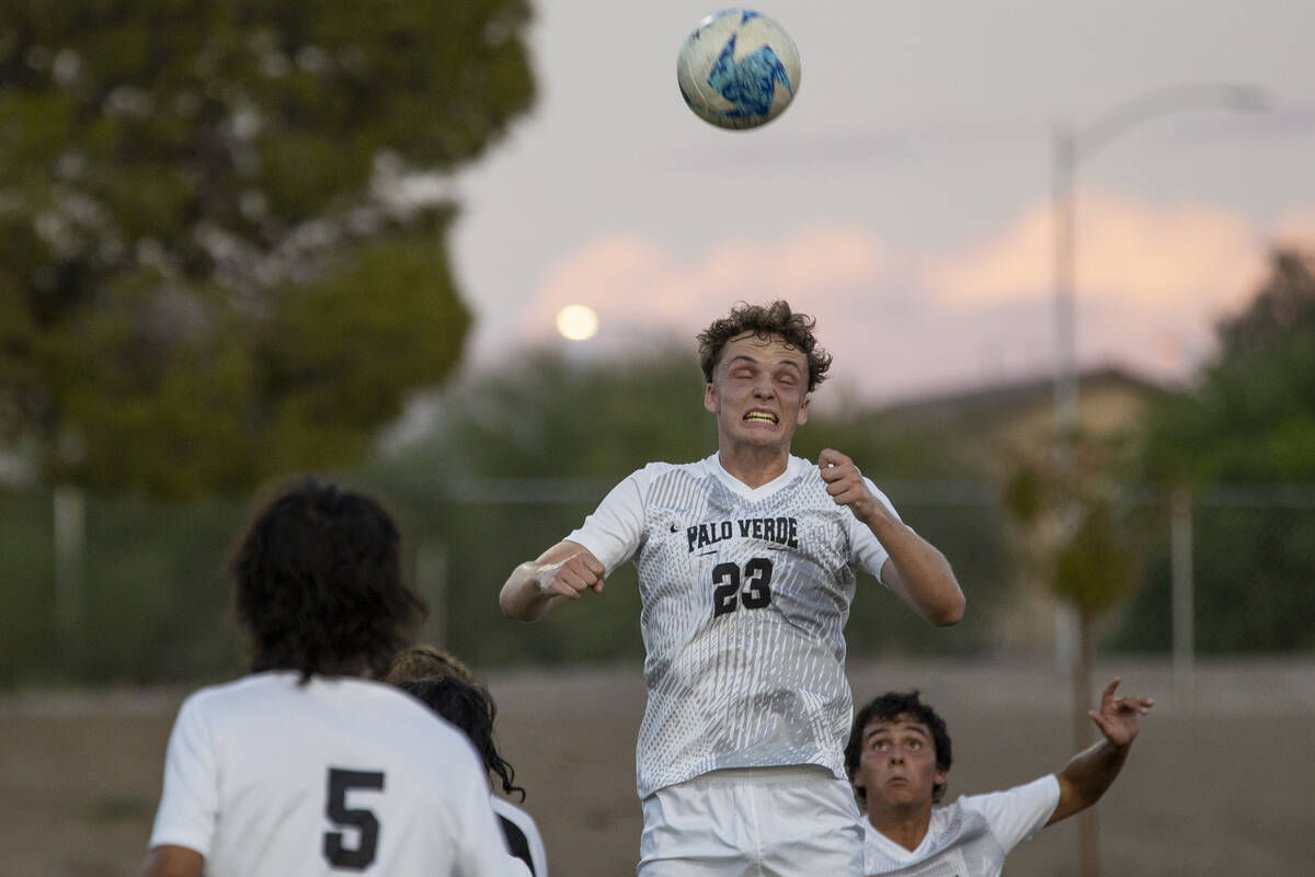 Palo Verde senior Benjamin Legrand (23) headbutts the ball during the high school soccer game a ...