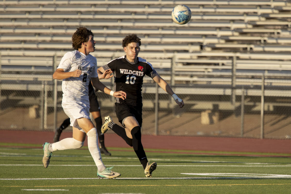 Palo Verde senior Jaxon Law (2) and Las Vegas High senior Daniel Murillo (10) run after the bal ...