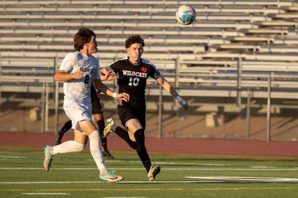 Palo Verde senior Jaxon Law (2) and Las Vegas High senior Daniel Murillo (10) run after the bal ...