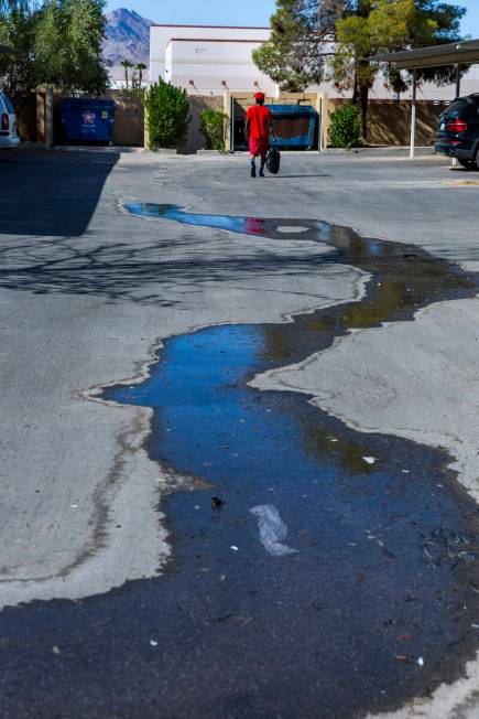 Water continues to flow in one of many carports in the Somerset Park community where seeping is ...