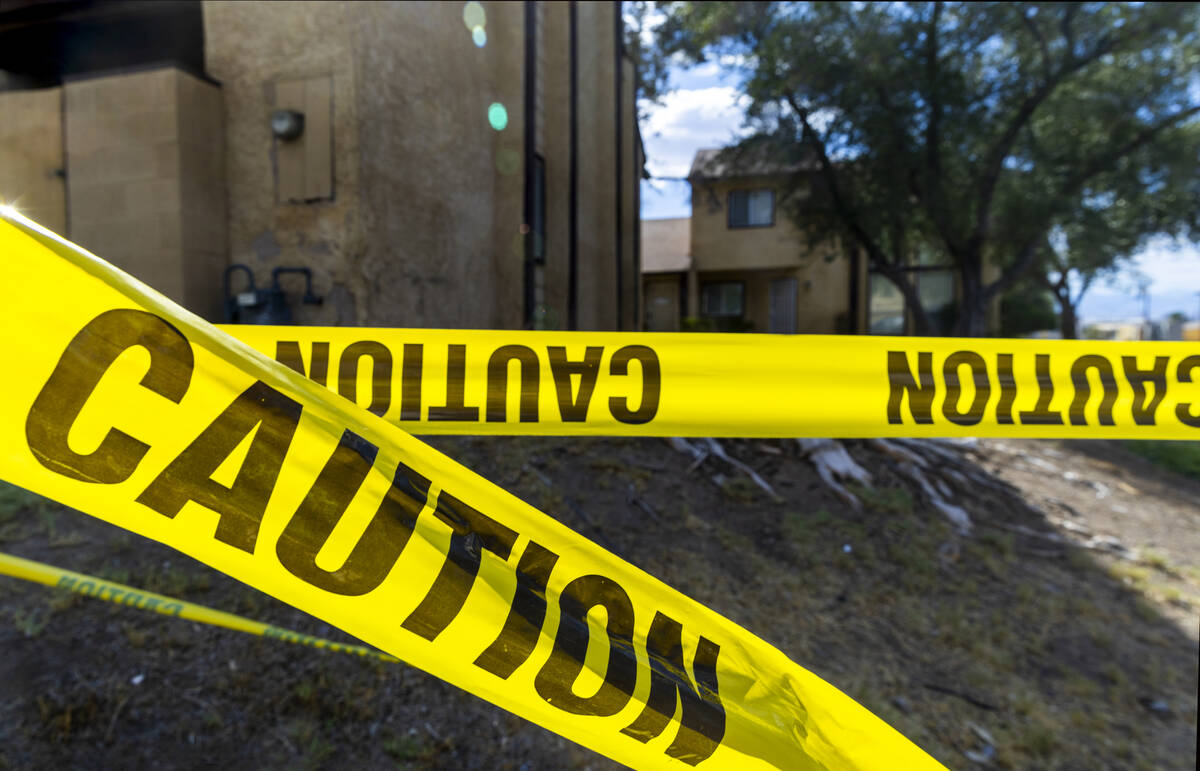 Caution tape is wrapped about a carport area as water continues to pool along Natalee Drive whe ...