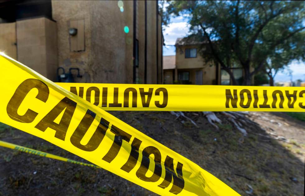 Caution tape is wrapped about a carport area as water continues to pool along Natalee Drive whe ...