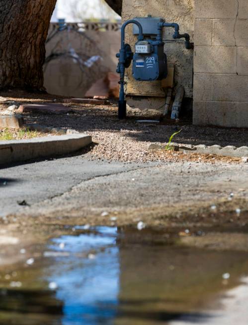 Water continues to flow in one of many carports in the Somerset Park community where seeping is ...