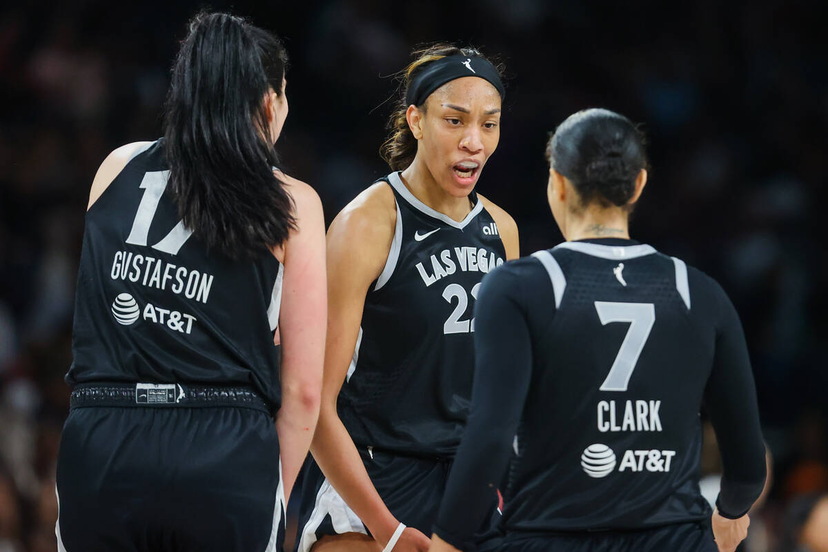 Aces center A'ja Wilson (22) pumps up her teammates, Aces forward Alysha Clark (7) and center ...