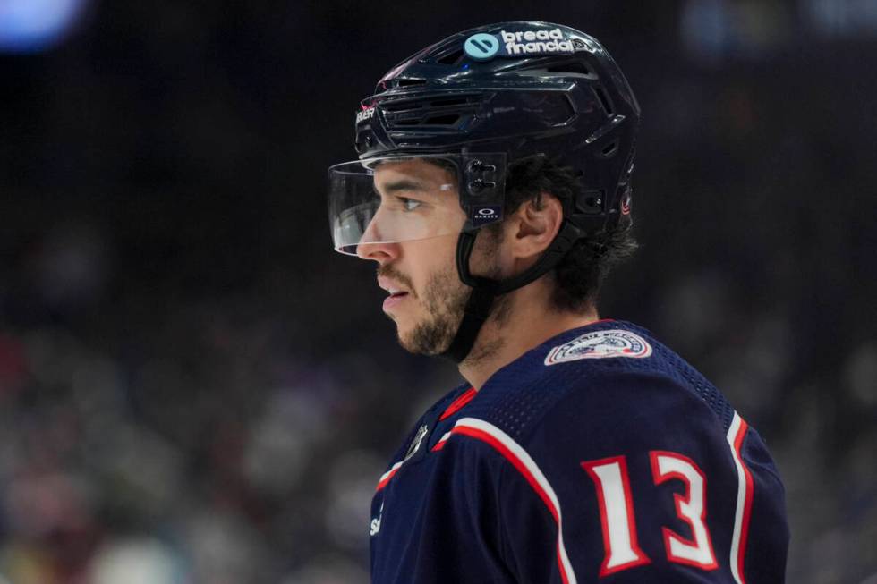 Columbus Blue Jackets' Johnny Gaudreau (13) awaits the face-off during an NHL hockey game again ...