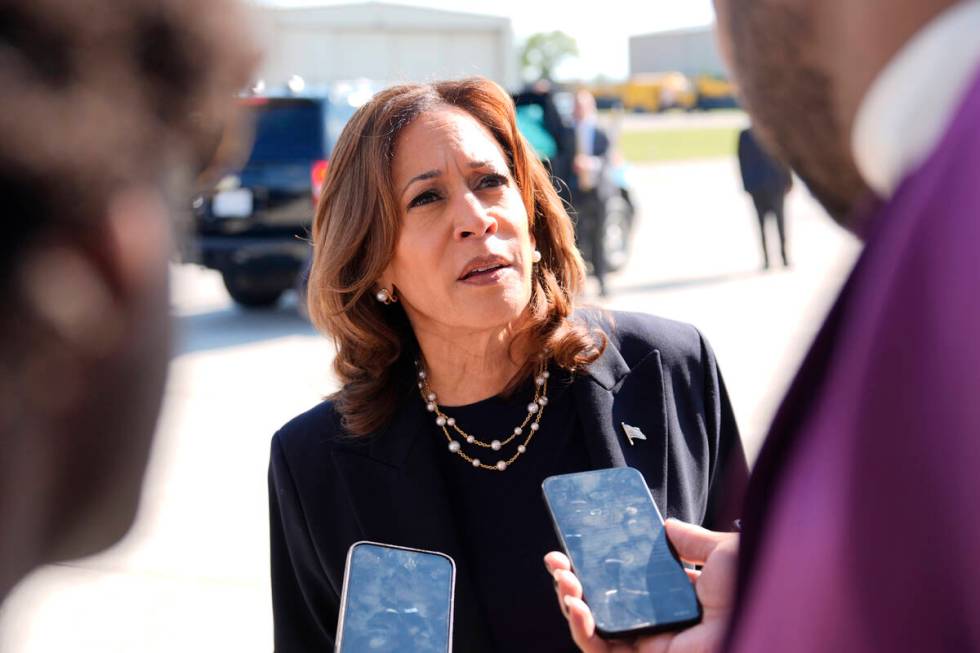 Democratic presidential nominee Vice President Kamala Harris talks to the media before boarding ...