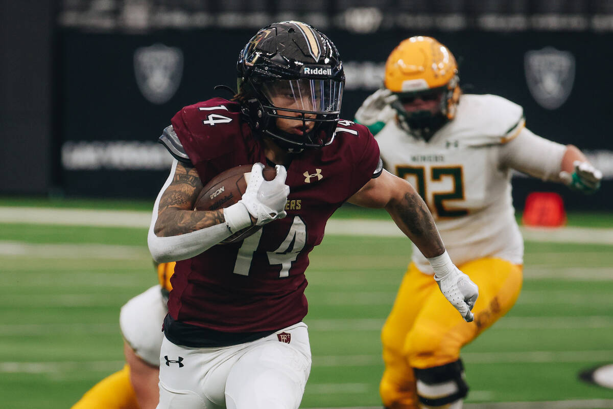 Faith Lutheran running back Cale Breslin (14) runs with the ball during a class 5A Division II ...