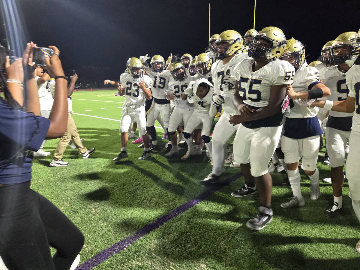 Spring Valley players celebrate after winning the "Banner Game" over Bonanza on Friday, Aug. 30 ...