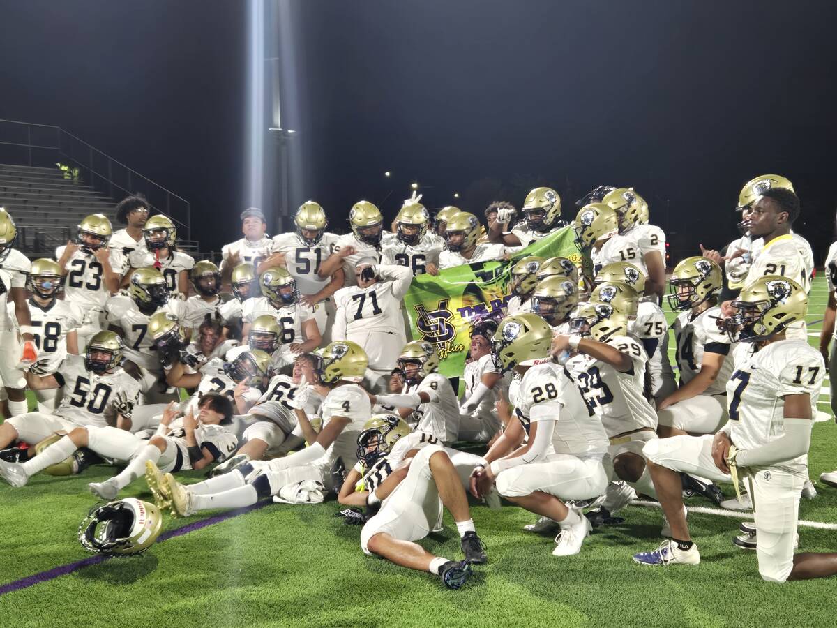 Spring Valley players celebrate after winning the "Banner Game" over Bonanza on Friday, Aug. 30 ...