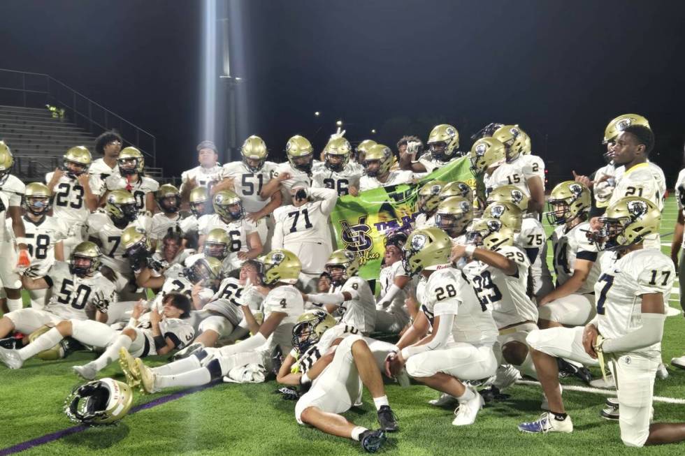 Spring Valley players celebrate after winning the "Banner Game" over Bonanza on Friday, Aug. 30 ...