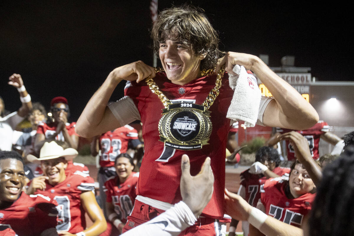 Arbor View quarterback Thaddeus Thatcher (7) is awarded the Raiders High School Showcase Most O ...