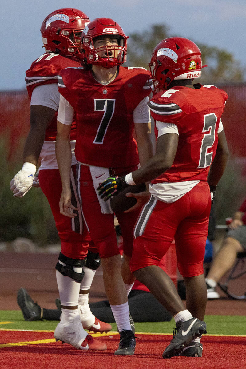 Arbor View quarterback Thaddeus Thatcher (7) celebrates with teammates after scoring a touchdow ...