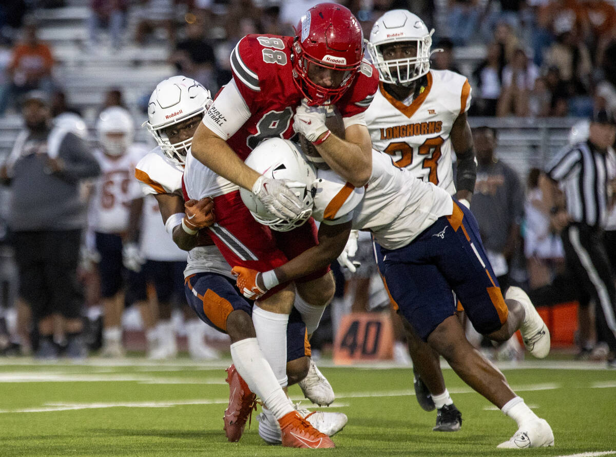 Arbor View tight end Zac Fares (88) is tackled during the Class 5A high school ‘Battle o ...