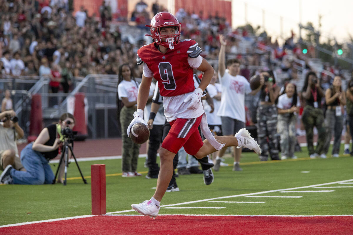 Arbor View wide receiver Kai Cypher (9) runs into the end zone during the Class 5A high school ...