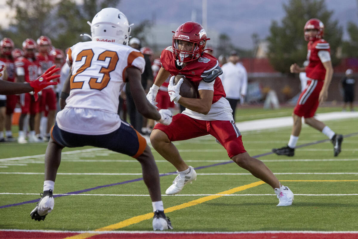 Arbor View wide receiver Kai Cypher (9) jukes Legacy senior Dorian Corzine (23) to score a touc ...