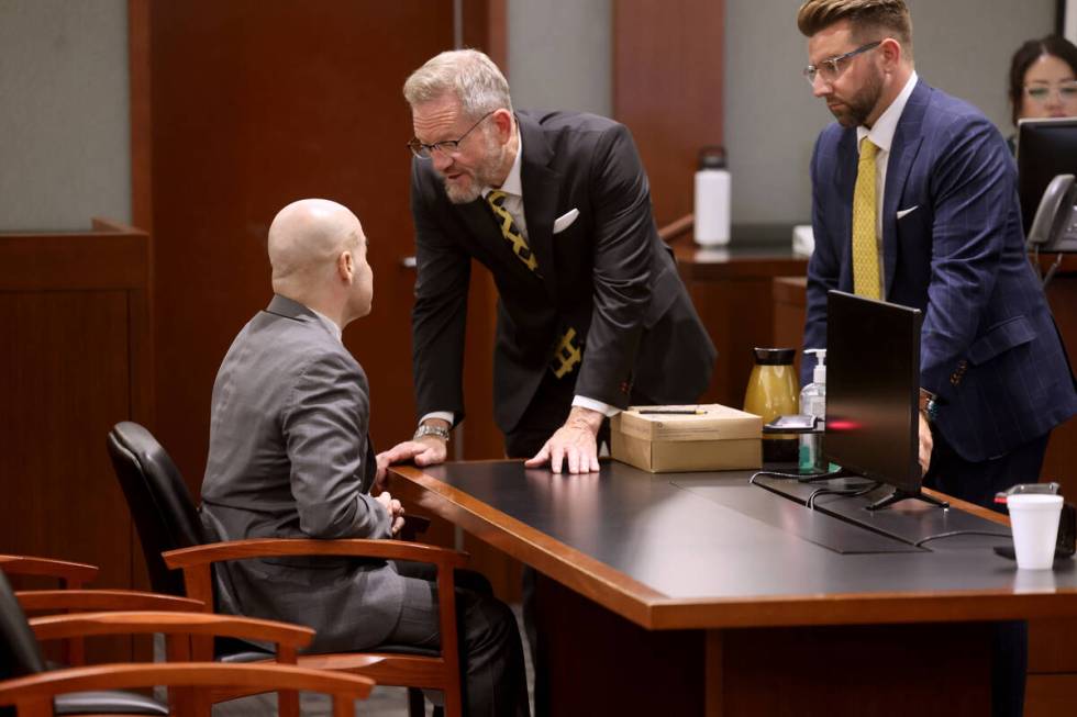 Robert Telles, left, talks to his attorneys Robert Draskovich, center, and Michael Horvath in t ...