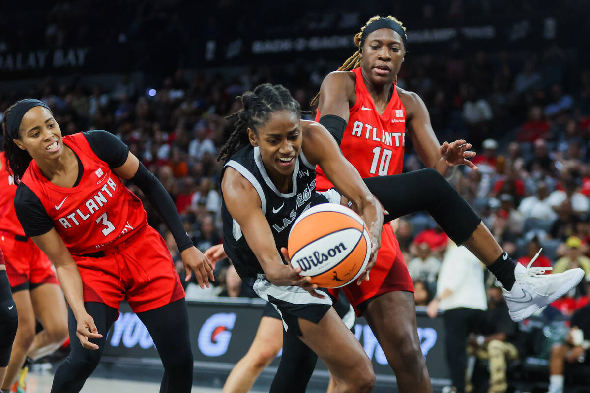 Aces guard Tiffany Hayes (15) reaches for the ball as it falls from her grip during a WNBA bask ...