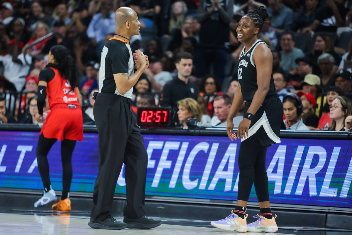 Aces guard Chelsea Gray (12) tries to reason with a referee during a WNBA basketball game betwe ...