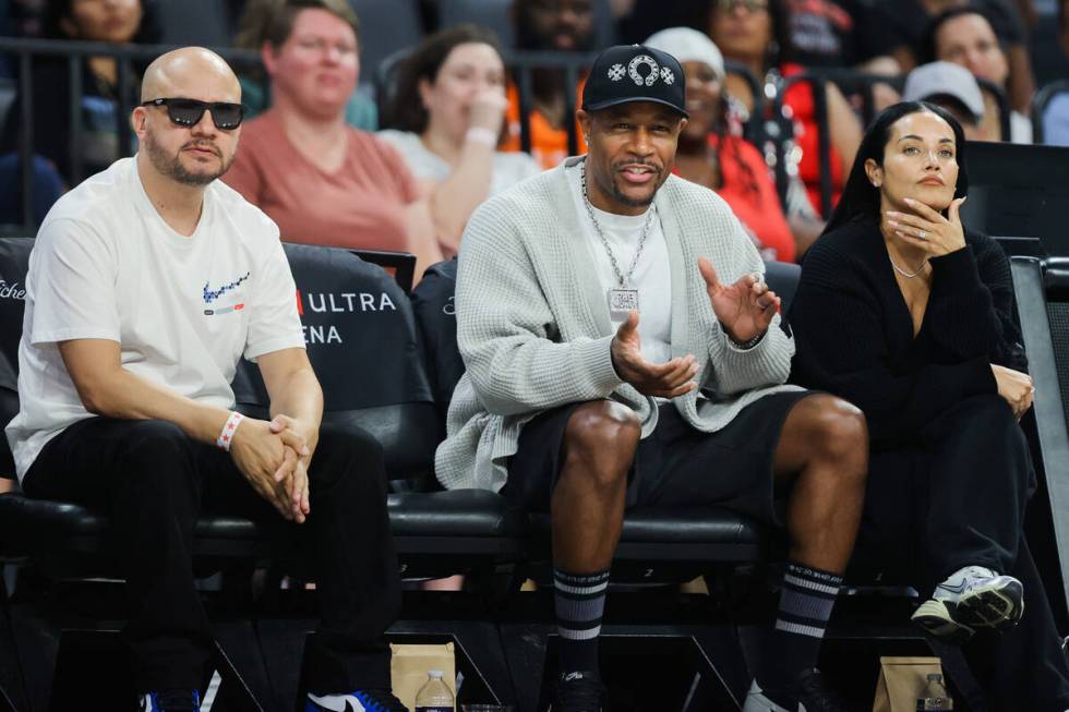 R&B singer Tank cheers for the Aces during a WNBA basketball game between the Las Vegas Ace ...