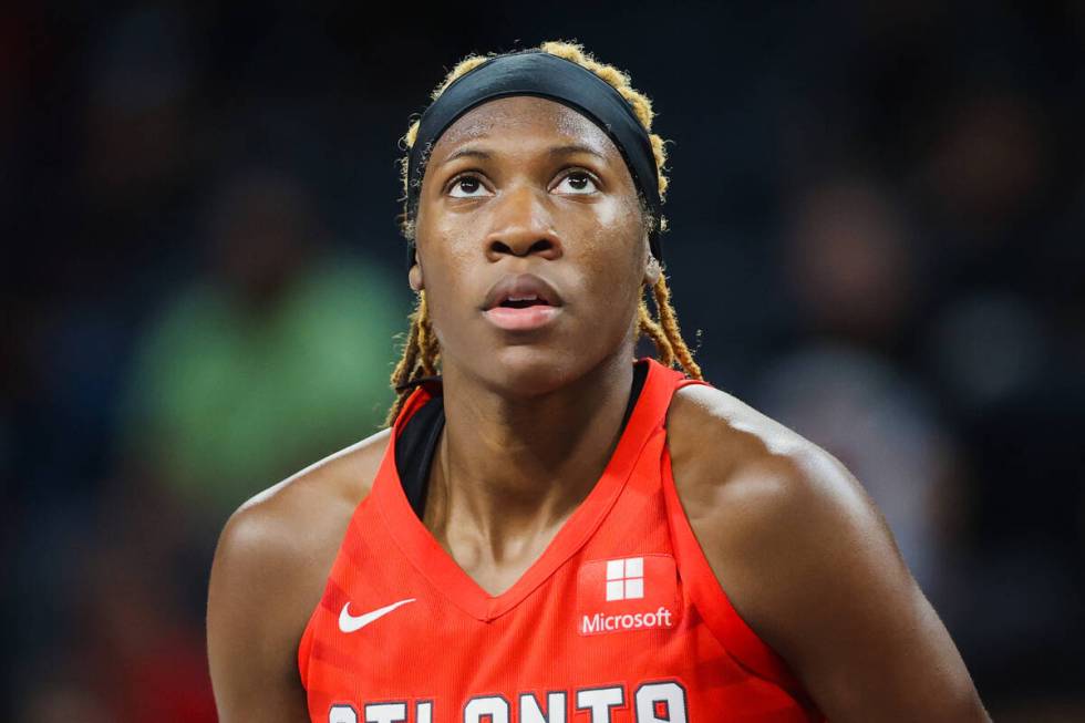 Atlanta Dream guard Rhyne Howard (10) watches a free throw during a WNBA basketball game betwee ...