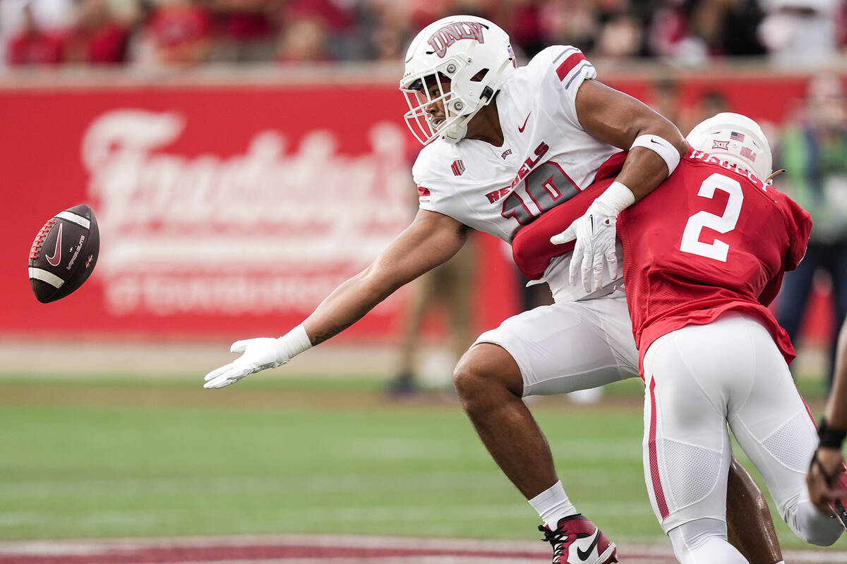 Houston defensive back A.J. Haulcy (2) breaks up a pass intended for UNLV wide receiver DeAngel ...