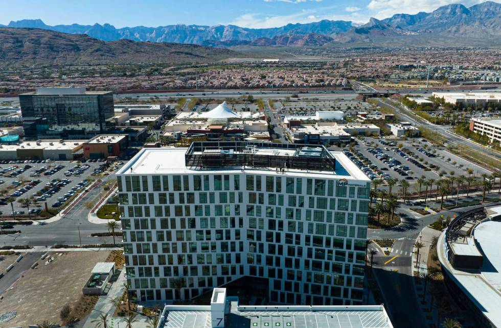 An aerial view of 1700 Pavilion, front, a ten-story office building, and One Summerlin, a 9-sto ...