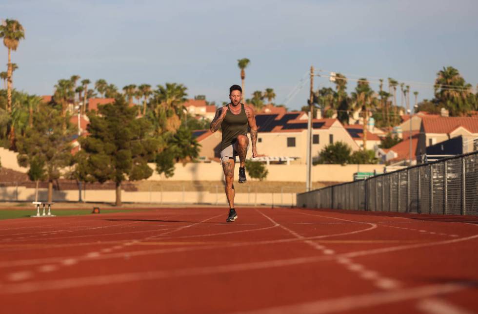 Local fitness influencer Troy Adashun warms up before running 100 meters for a video about trai ...