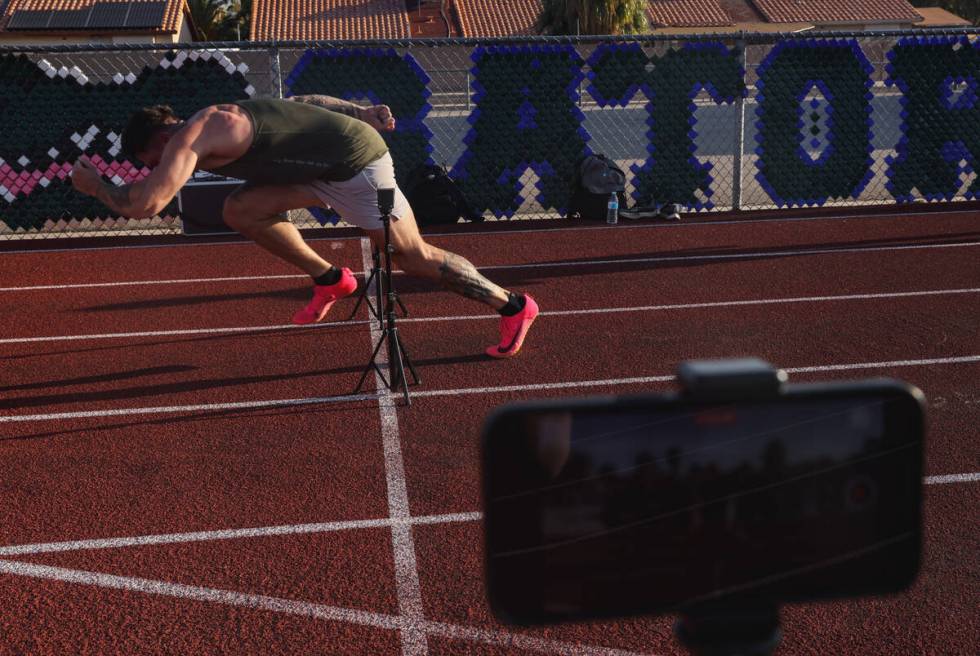 Troy Adashun, a local fitness influencer, sprints at a starting line for a video about training ...