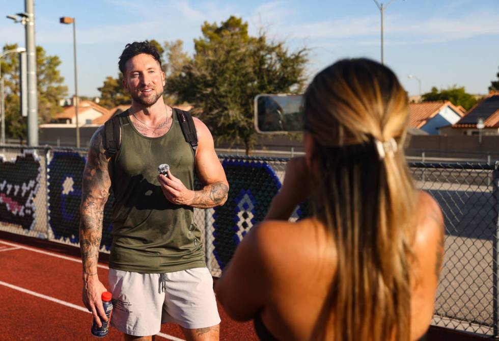 Troy Adashun, a fitness influencer, is filmed by his wife Kathy Adashun after sprinting for his ...