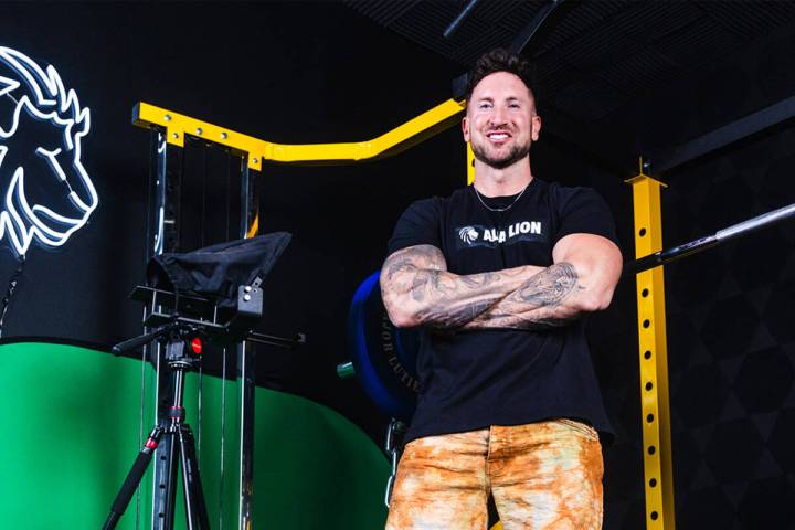 Troy Adashun, a local fitness influencer, poses for a portrait in his home gym in Henderson, Mo ...