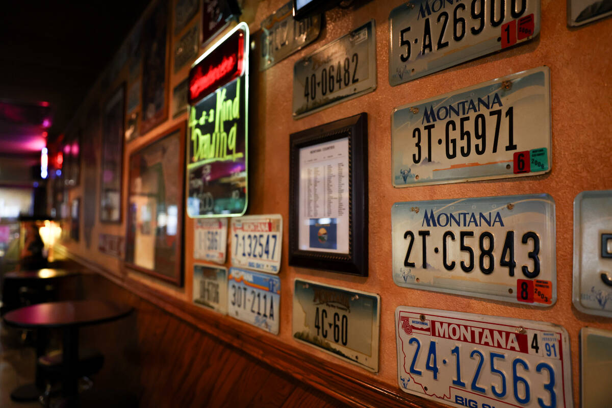 Montana license plates adorn the walls at Torrey Pines Pub on Wednesday, Aug. 21, 2024, in Las ...