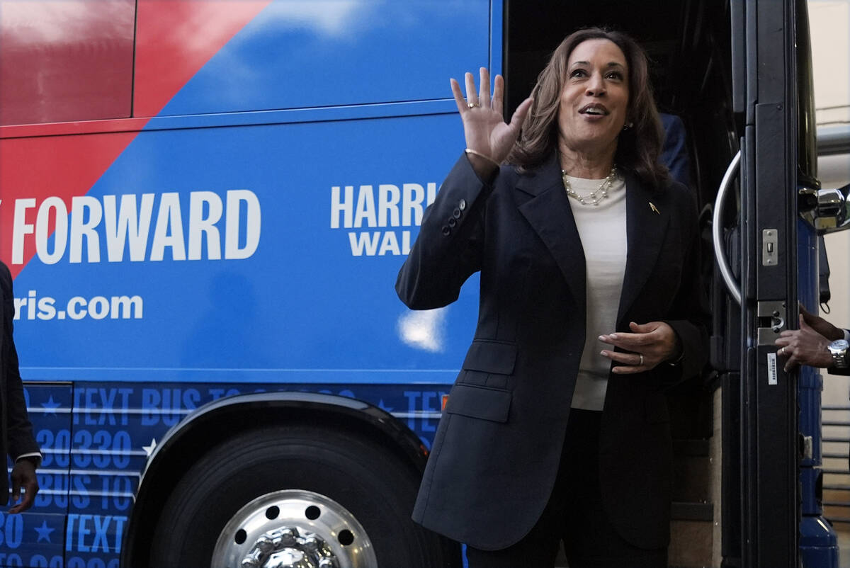 Democratic presidential nominee Vice President Kamala Harris waves as she exits her campaign bu ...