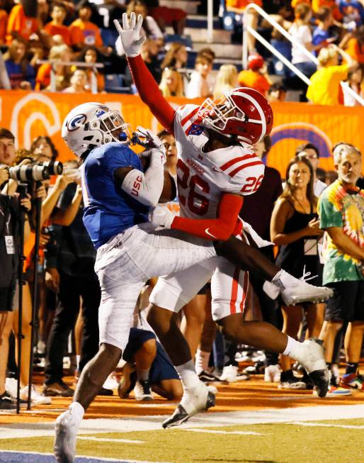 Bishop Gorman's wide receiver Zachariah Branch (1) catches a touchdown pass as Mater Dei's defe ...