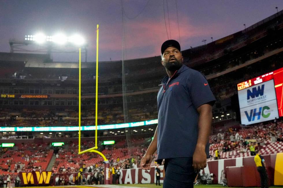 New England Patriots head coach Jerod Mayo walks onto the field before an NFL preseason footbal ...