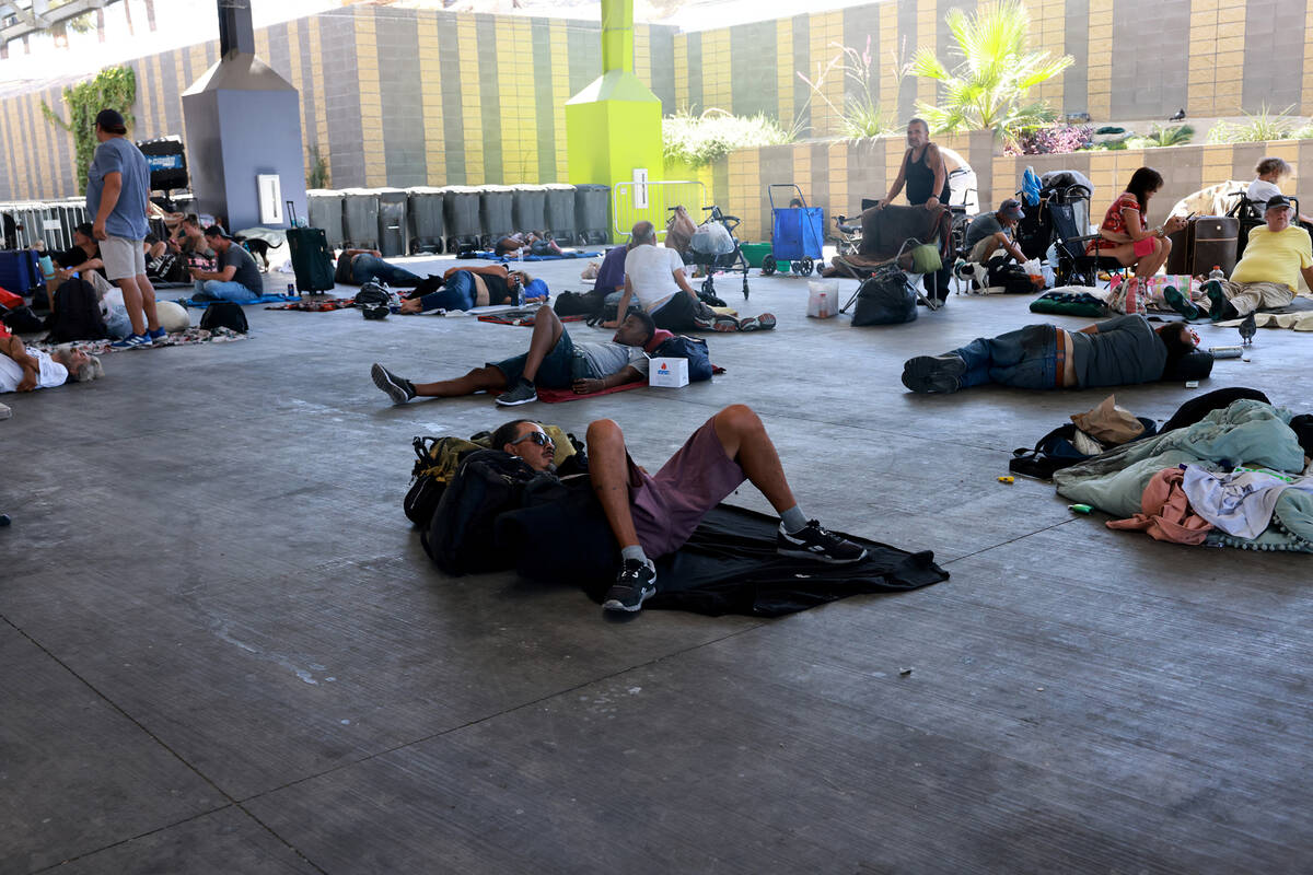 People beat the heat with misters and shade at the Courtyard Homeless Resource Center in Las Ve ...