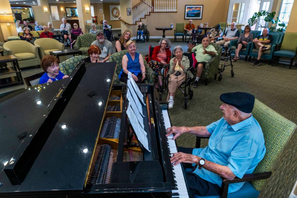 95-year-old pianist Don "Pops" Friend sings to his audience as he plays his finale at ...