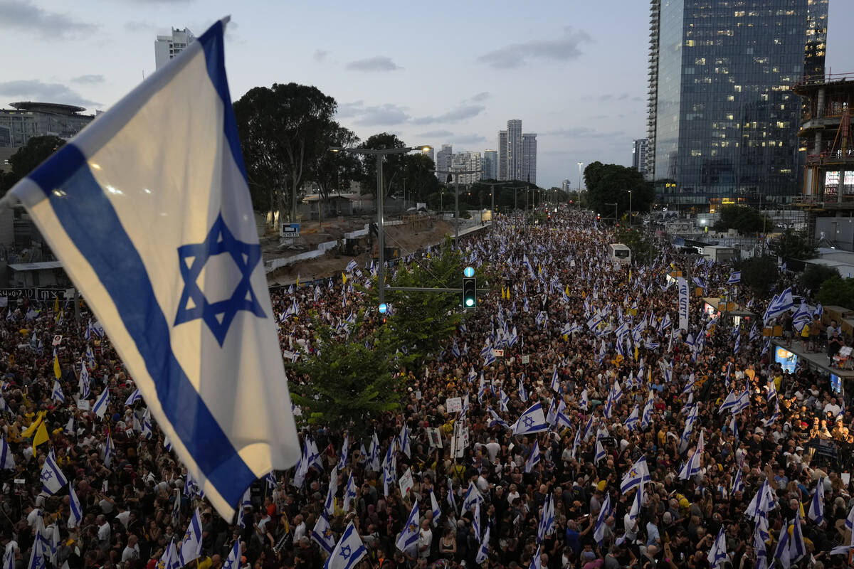 People take part in a protest calling for a deal for immediate release of hostages held in the ...