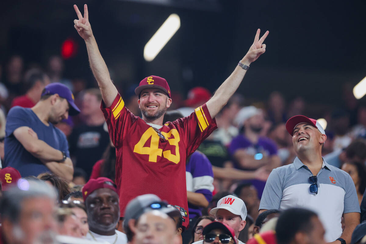 A Southern California fan cheers during the Vegas Kickoff Classic NCAA football game between LS ...