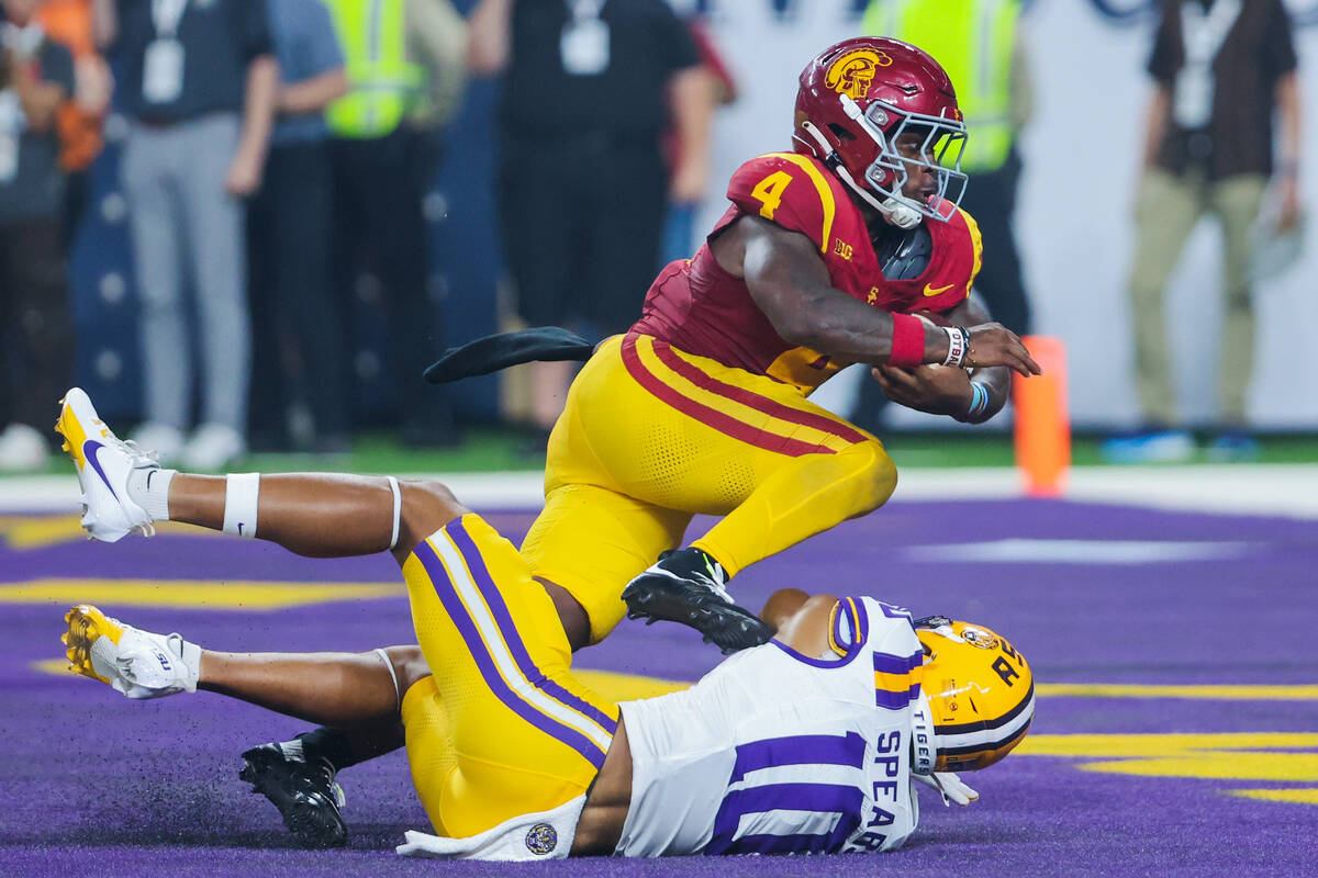 LSU safety Dashawn Spears (10) fails to bring down Southern California running back Woody Marks ...