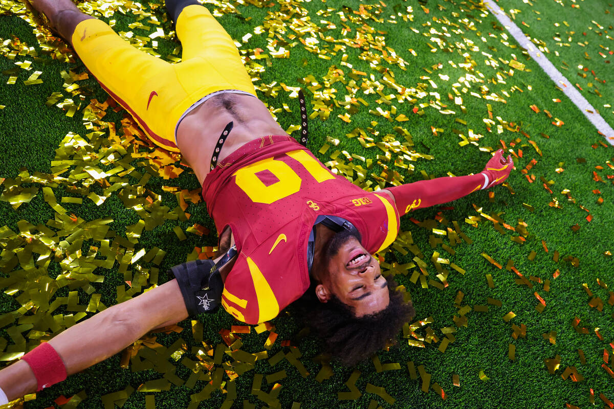 Southern California linebacker Eric Gentry celebrates winning the Vegas Kickoff Classic NCAA fo ...